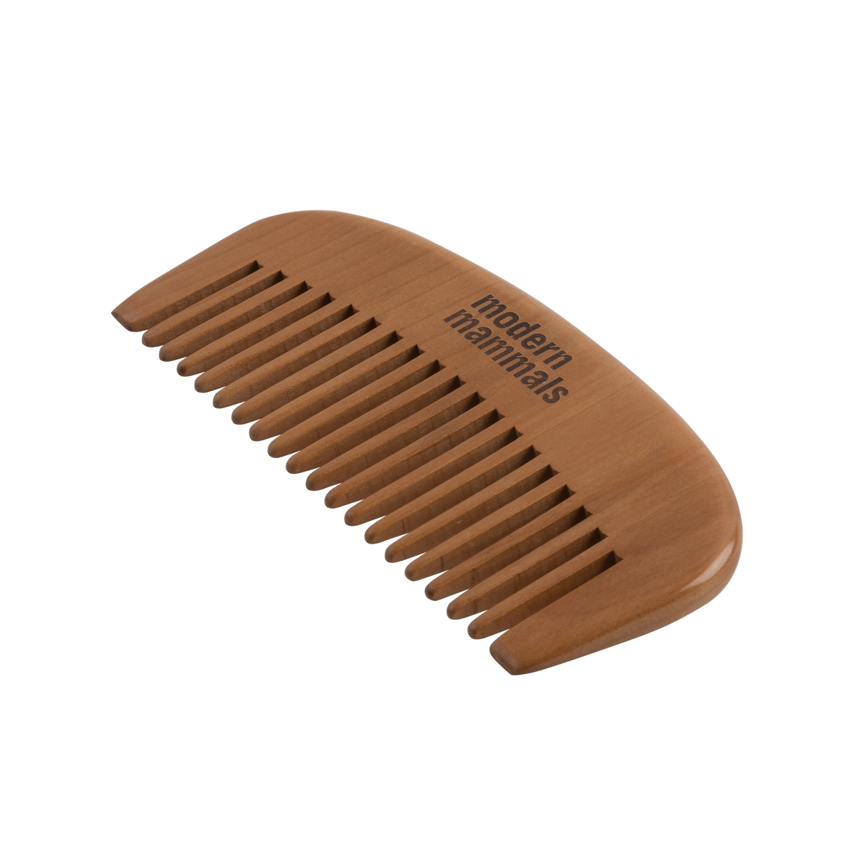 Angled top-down view of wide-tooth wooden comb showcasing smooth wide teeth and Modern Mammals engraving on a white background