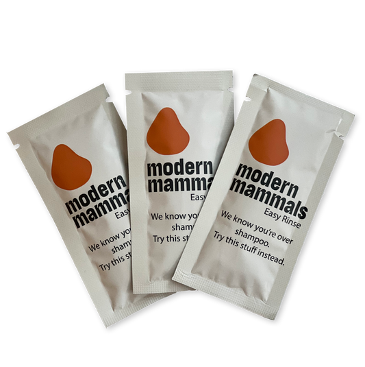 Three sachets of Modern Mammals Easy Rinse with text: "We know you're over shampoo. Try this stuff instead"